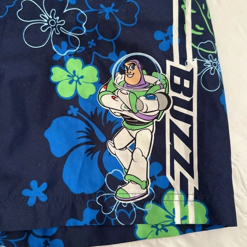 Disney blue green hibiscus print Buzz Lightyear mesh lined swim trunks M